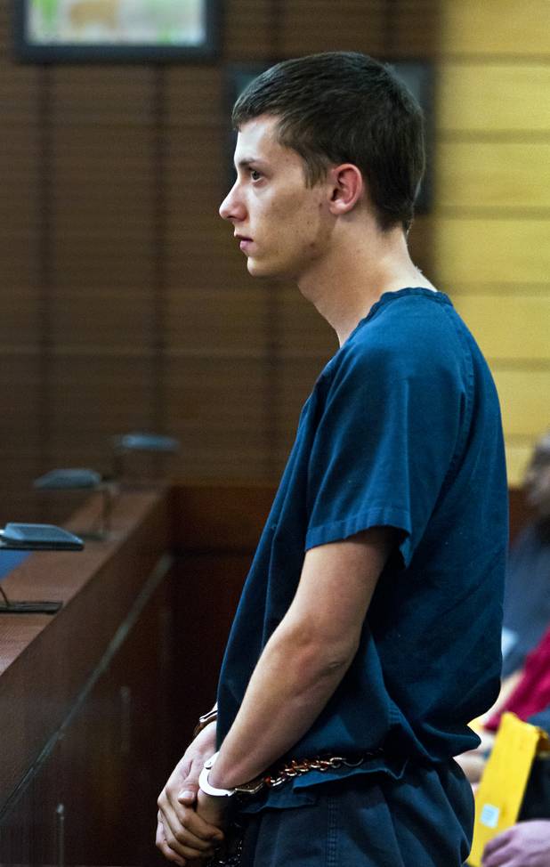 Colin Lowrey stands stoically while listening to his lawyer Stephen Stein plead for a lower bail to be set in Henderson Justice Court on Wednesday, Nov. 6, 2013.